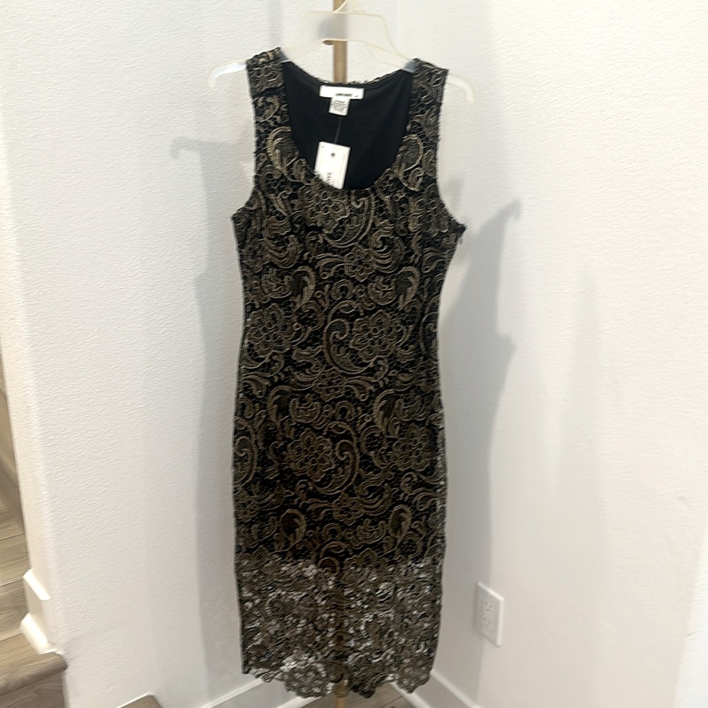 Black Sans Souci dress with gold stitching details